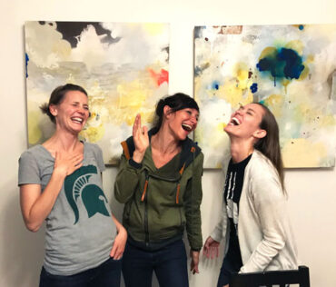 Mom-friends-laughing-together-mom-groups-Lansing-1