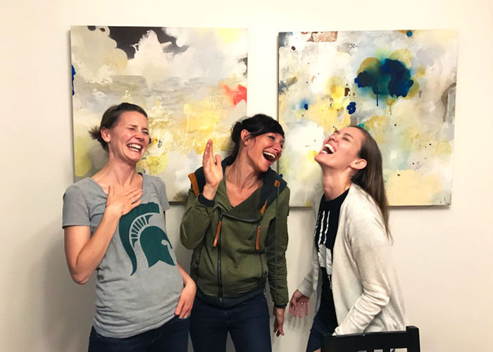 Mom-friends-laughing-together-mom-groups-Lansing-1
