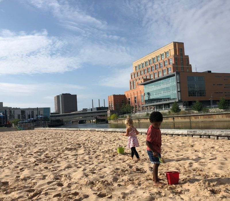 Kids-playing-in-the-sand-at-Rotary-Park-Downtown-Lansing-Summer-things-to-do