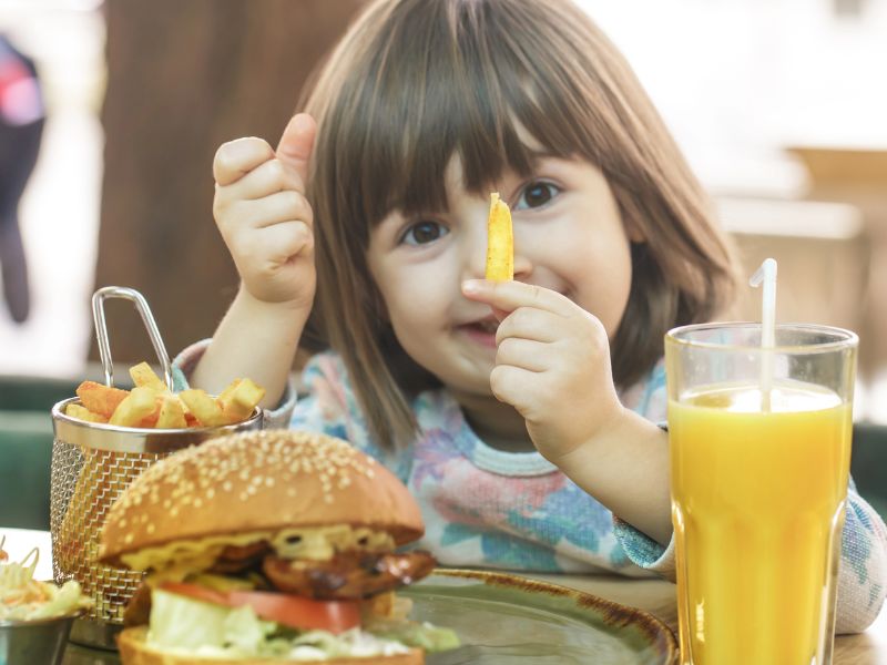kids eat free lansing little girl with burger and fries