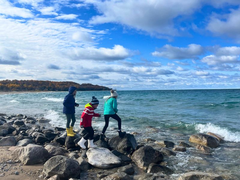 Bundled up on a Winter Beach Day in Michigan. Hunting for Petoskey Stones