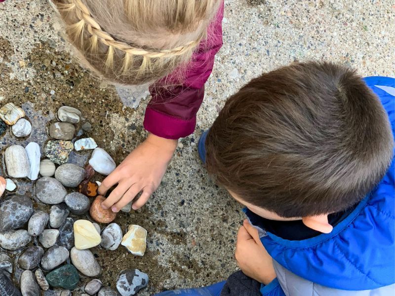 kids looking for petoskey stones at Magnus Park Beach in Petoskey Michigan