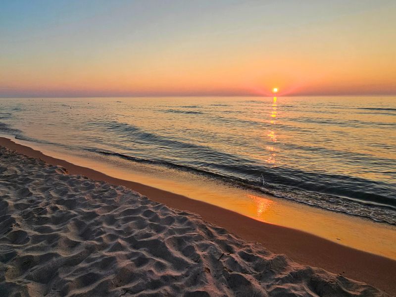 Sunrise over Lake Huron at a beach in Oscoda, MI