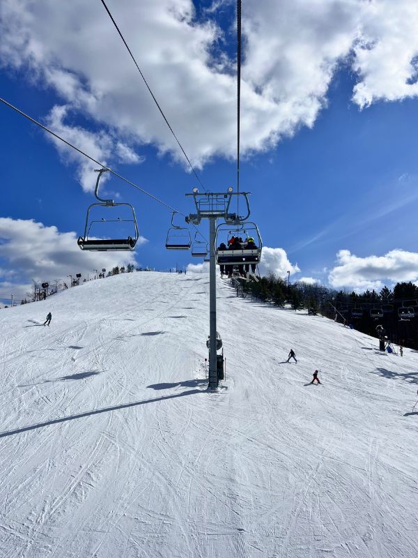 Riding the lift over the slopes at Caberfae Peaks Ski Resort in Cadillac, MI