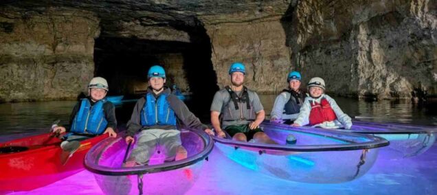 Four People In Kayaks Red River