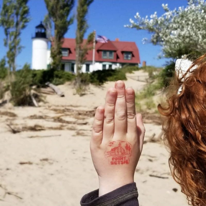 Point Betsie Girl With Stamped Hand In Front Of Lighthouse Berta Via Rudd